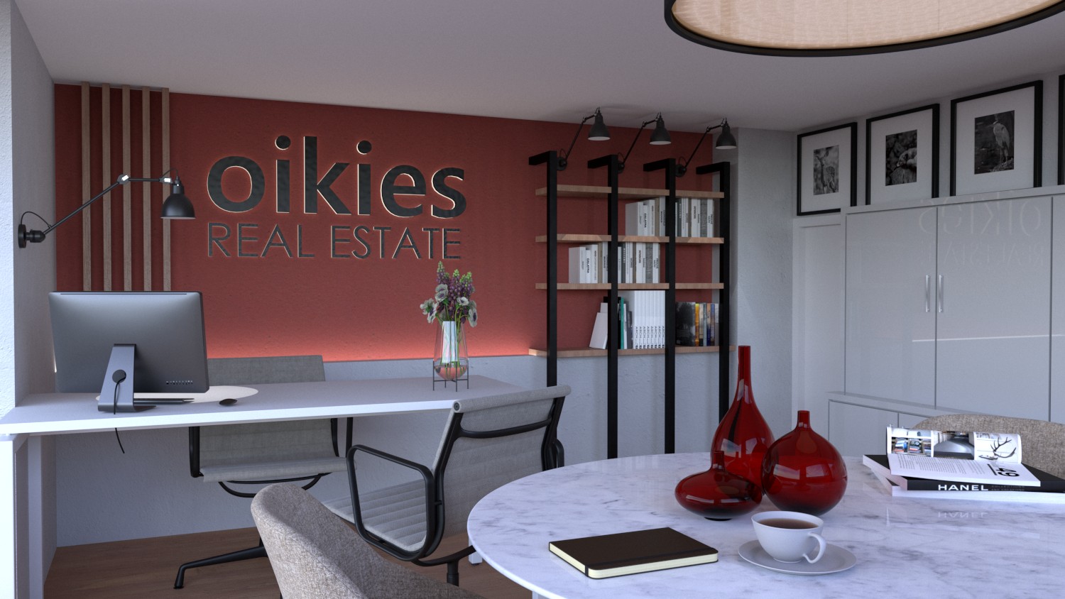 Modern real estate office interior with “oikies real estate” wall sign, desk, shelves, and red vases.